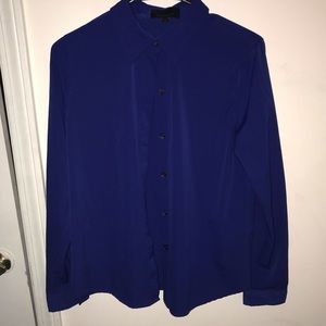 Blue button-down blouse.